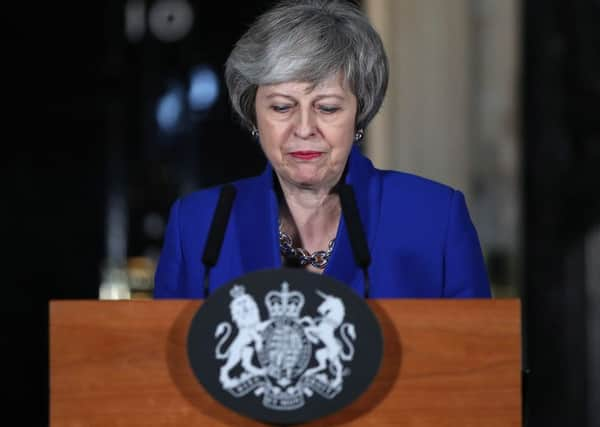 Theresa May speaks outside 10 Downing Street after surviving a vote of no confidence.