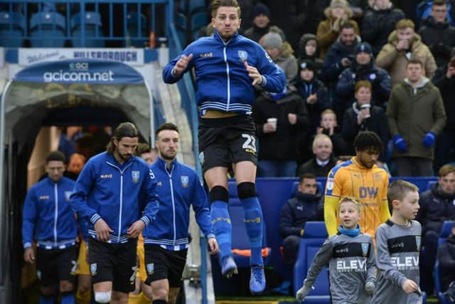 Sam Hutchinsons exuberance at being back in Sheffield Wednesdays first team shows itself as he takes to the field at Hillsborough (Picture: Steve Ellis).