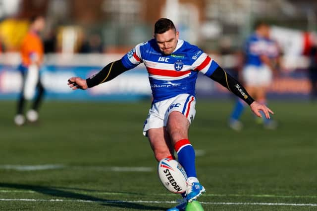 Wakefield Trinity's Danny Brough kicks a penalty.