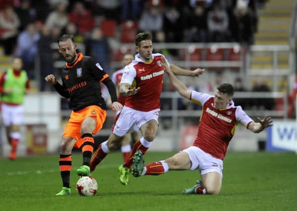 Sheffield Wednesday's Steven Fletcher comes under pressure during the Owls' last visit to the New York Stadium. Picture: Steve Ellis.