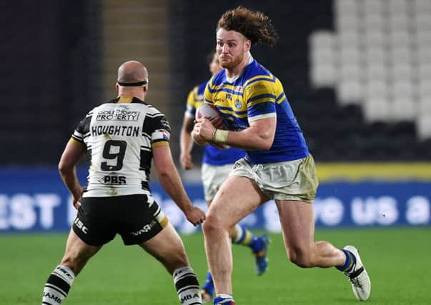 Rhinos.
Rhinos Anthony Mullally takes on Hull's Danny Houghton. 
Picture Jonathan Gawthorpe