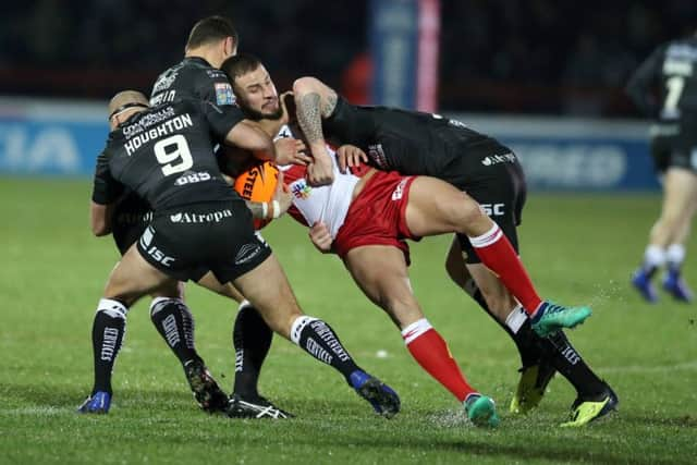 Hull KRs Ben Crooks, seen being tackled during the derby win over Hull KR, had to be taken to hospital on a spinal board and with his neck in a brace after Sundays victory over London Broncos (Picture: Danny Lawson/PA).