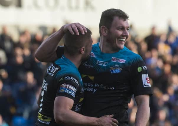 Brett Ferres congratulates Jack Walker on his try.