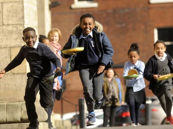 Pancake races at Leeds Minster. Picture by Simon Hulme