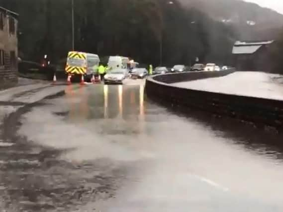 The A646 in Todmorden has been flooded by the River Calder.