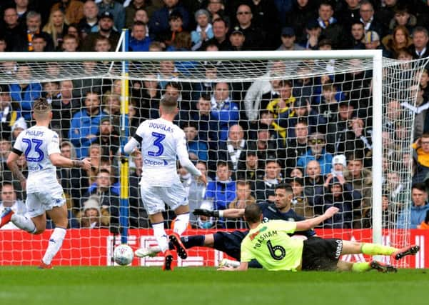 Sheffield Uniteds Chris Basham hits the deck after sliding in the only goal of the game for the visitors against Leeds United (Picture: Bruce Rollinson).