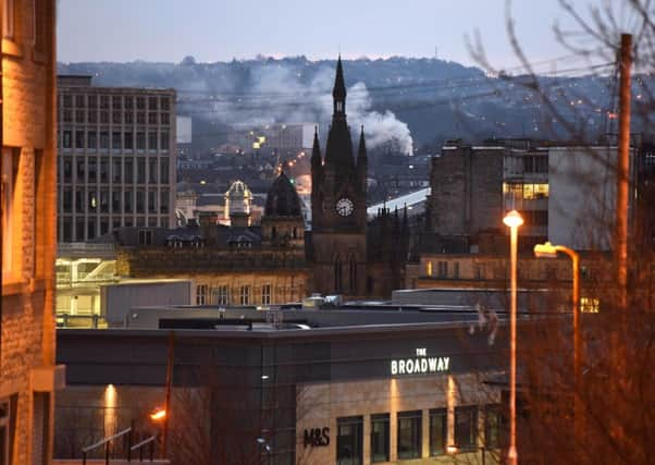 The gothic Victorian spire of the Wool Exchange dominates the Bradford city centre skyline