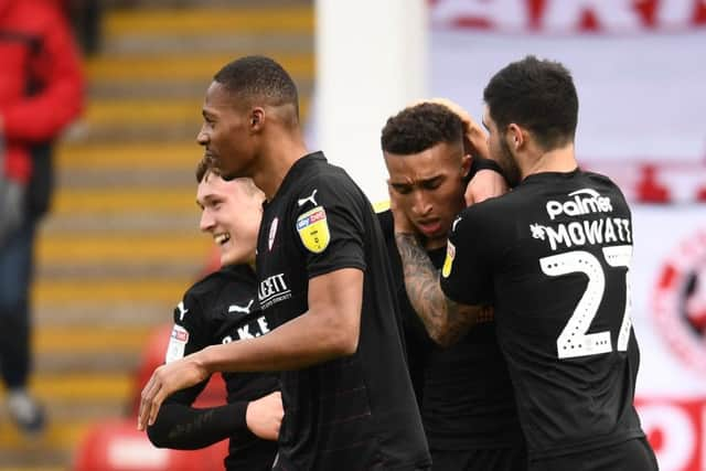 In at the death: Jacob Brown is congratulated for his late winner.