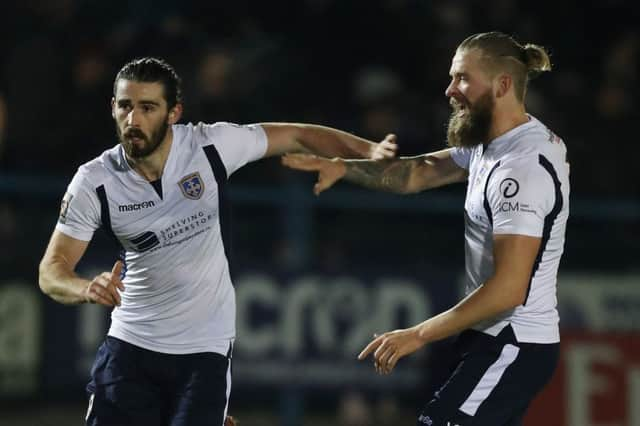 Guiseley's Alex Purver (left) scored the winner against Curzon Ashton.