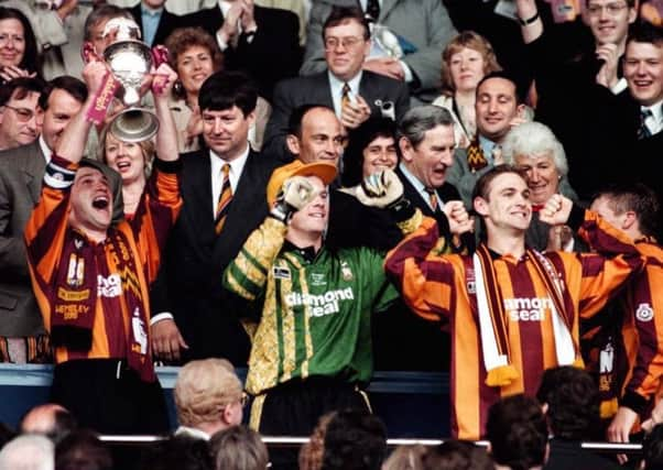 On the up: Bradford City captain Eddie Youds holds the Endsleigh Insurance League trophy in celebration after victory over Notts County at Wembley.