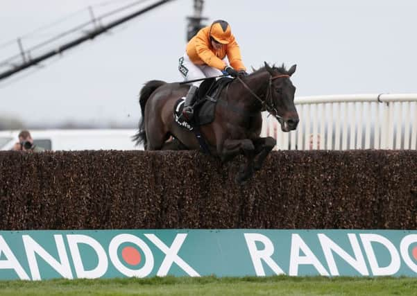 Tea For Two and Lizzie Kelly - pictured winning the 2017 Betway Bowl - are due to line up in the Grand National this weekend.