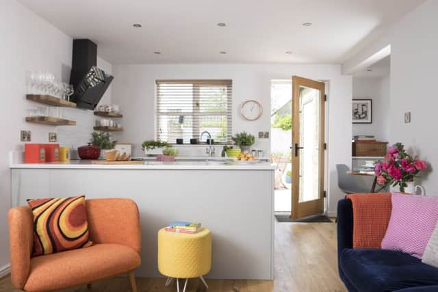 The new kitchen with shelves instead of wall cupboards.