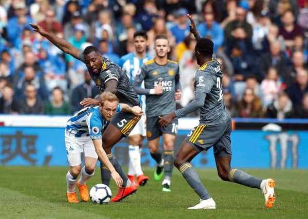 Huddersfield Town's Alex Pritchard (left) and Leicester City's Wes Morgan at the John Smith's Stadium, Huddersfield. (Picture: PA)