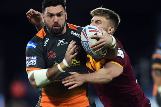 Huddersfield's Alex Mellor ensures Castleford's Matt Cook is going nowhere.
 (
Picture: Jonathan Gawthorpe)