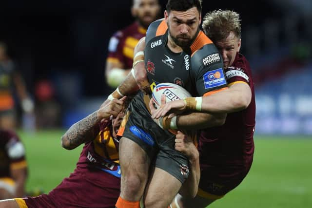 Tough tackling:
Castleford's Matt Cook is tackled by Huddersfield's Alex Mellor and Aaron Murphy.
 (Picture: Jonathan Gawthorpe)