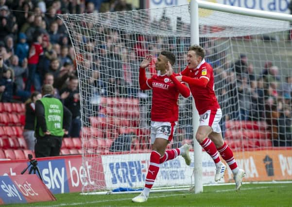 Game over: Jacob Brown celebrates with Callum Styles after scoring the fourth goal.