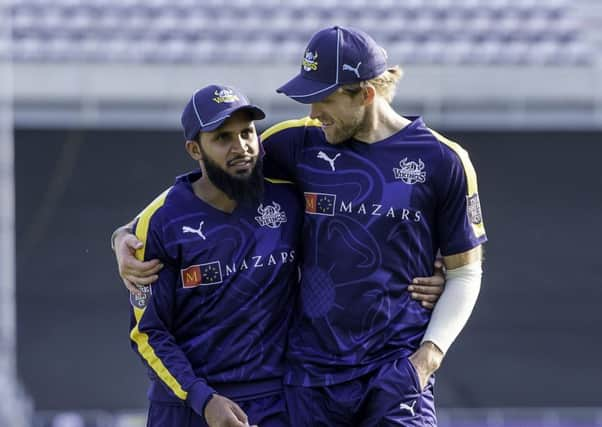 On their way: Yorkshire's Adil Rashid and David Willey.