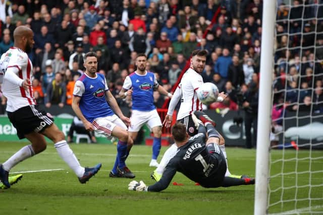 Sheffield United's Scott Hogan scores.