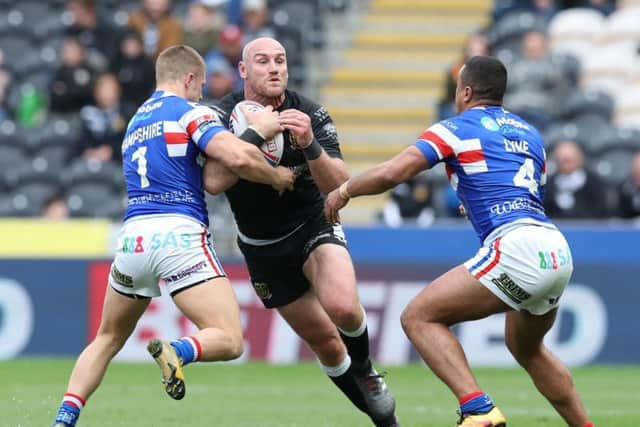 Wakefield Trinity's Ryan Hampshire and Reece Lyne try to stop Hull FC's Gareth Ellis. (SWPix)