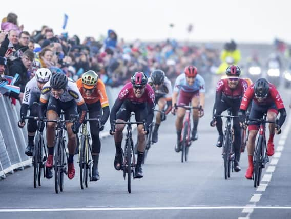 Alexander Kamp, second left, takes the win from Chris Lawless of Team Ineos