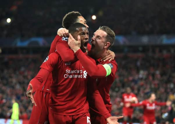 Liverpool's Georginio Wijnaldum celebrates scoring his side's third goal against Barcelona at Anfield. Picture: Peter Byrne/PA.