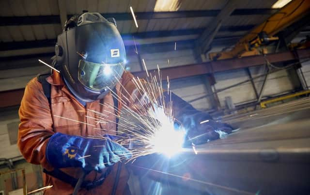 A welder at work in one of Integra Buildingsfactory units.