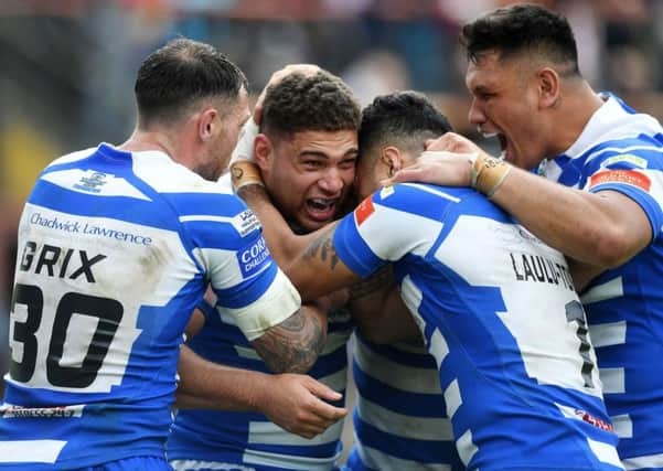 Halifax's James Woodburn-Hall is congratulated on his winning try. against Bradford Bulls on Sunday.
 Picture: Jonathan Gawthorpe.