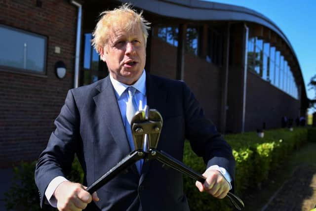 Former Foreign Secretary Boris Johnson visits a police HQ in Berkshire.