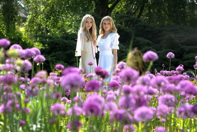 Charlie wears 1970s chiffin latered maxi dress in cream with fan sleeves, £75. Picnic basket from Bettys.
Elisha wears: 1970s white cotton broderie anglaise maxi dress, £75.
Picture: Simon Hulme
Styling: Stephanie Smith for the Yorkshire Post Magazine
Clothes and accessories: Catherine Smith Vintage Fashion in Harrogate
Hair & Make-up: Lauren Rippin
Models: Charlie Cowap and @Elisha_blogs
Location: RHS Garden Harlow Carr in Harrogate
All teatime treats and accessories: Bettys.