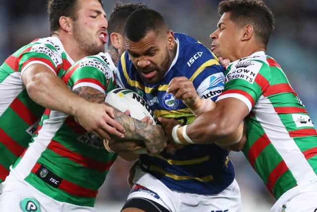 Paramatta's Manu Ma'u takes on South Sydney, including Sam Burgess (far left) in the NRL. (Photo: Matt King/Getty Images)