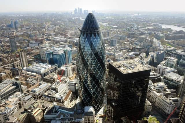 The Gherkin with Canary Wharf in the distance..
 Photo credit: Anthony Devlin/PA Wire