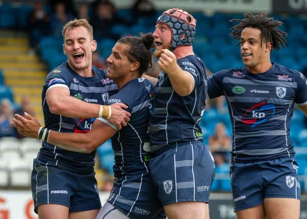 Ashton Golding celebrates his try against Rochdale. Picture: James Heaton.