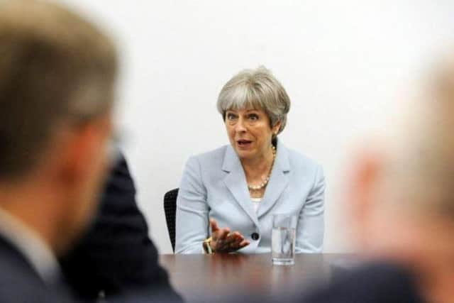 Theresa May during a visit to The Yorkshire Post office