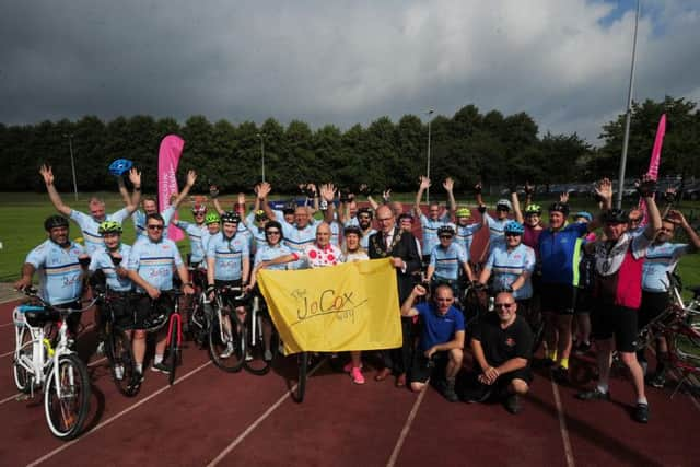 The Jo Cox Way Bike ride, Princess Mary Stadium, Cleckheaton. Jo Cox's sister Kim Leadbeater is pictured with cycling legend Brian Robinson, 89, with the cyclists. 
Picture by Simon Hulme