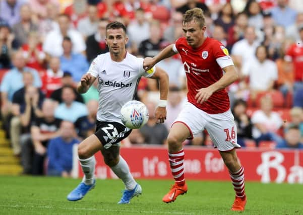 Match-winner: 
Barnsley's goal-scoring hero Luke Thomas breaks free from Joe Bryan. Picture: Dean Atkins