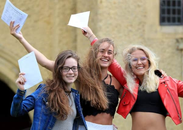 Joyous students celebrate their A-Level results.