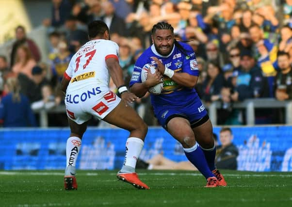 Rhinos' Konrad Hurrell takes on Saints' Dom Peyroux.   Picture Jonathan Gawthorpe