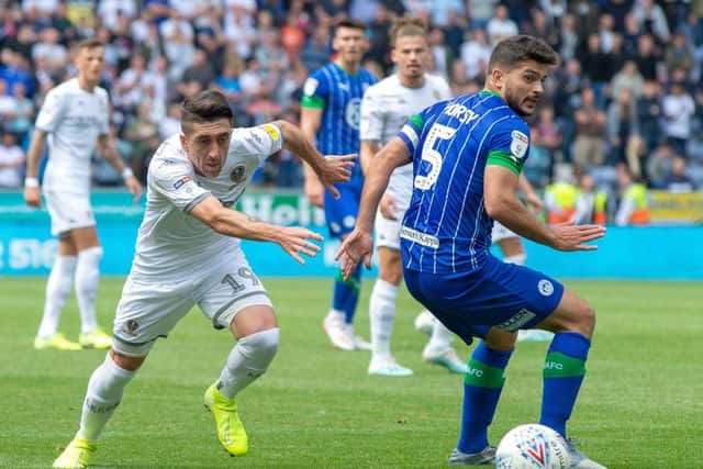 He's behind you: Pablo Hernandez goes past Sam Morsy.