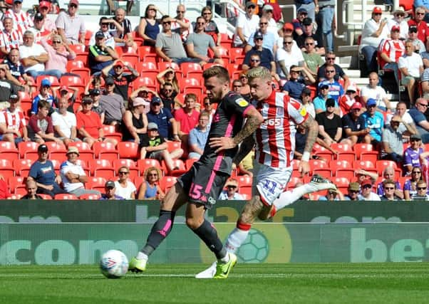 Take that: Stuart Dallas scores the opening goal for Leeds. Picture: Simon Hulme