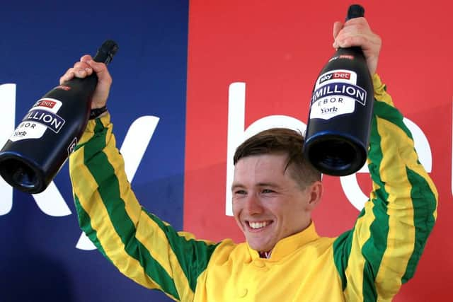 Jockey Colin Keane celebrates his Ebor win on Mustajeer.