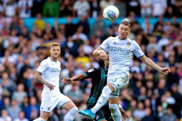 Ezgjan Alioski beats Andrew Ayew to the ball (Picture: Bruce Rollinson)