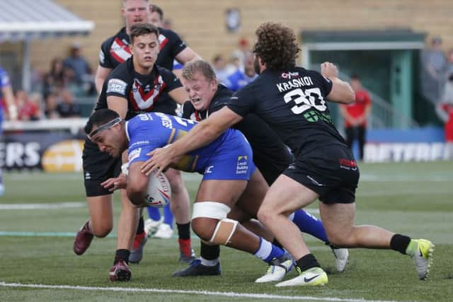 Going through: Ava  Seumanufagai powers over for a try for Leeds.