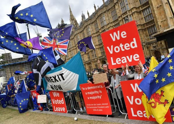 Protesters continue to gather outside the Houses of Parliament.