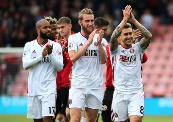 Sheffield United's David McGoldrick (left), Oliver McBurnie and Luke Freeman (right).