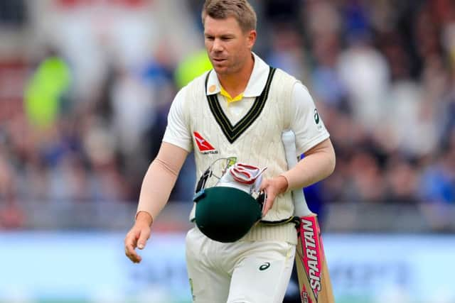 Trudging off: Australia's David Warner.