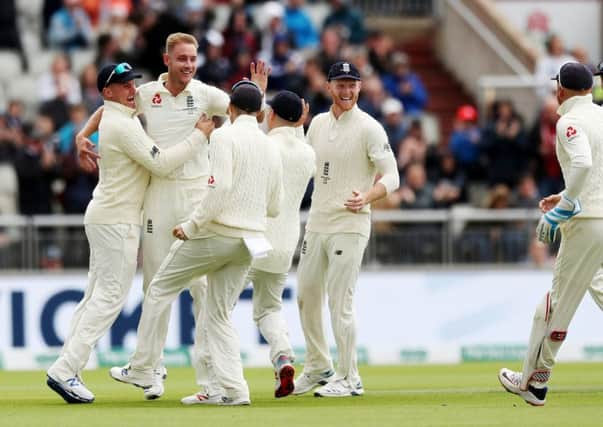 Got him again: England's Stuart Broad celebrates taking the wicket of Australia's David Warner at Old Traford.