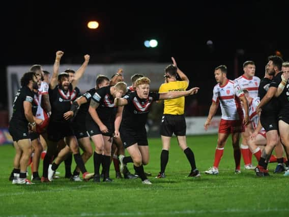 London Broncos players start celebrations at the final whistle after beating Hull KR. (PIC: JONATHAN GAWTHORPE)