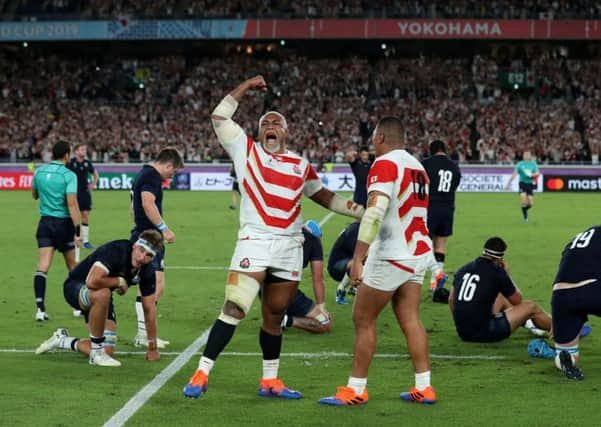 History boys: Japans Isileli Nakajima celebrates his nations victory over Scotland in Yokohama. (Picture: David Davies/PA)