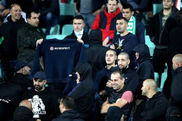 Bulgaria fans show their feelings after the game was temporarily halted (Picture: AP)