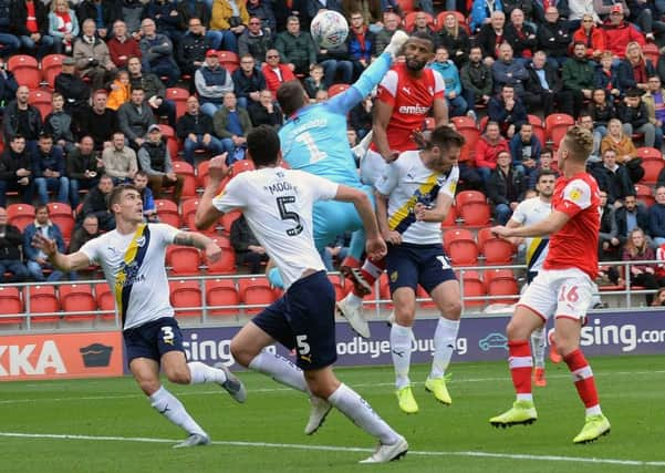 On target: Millers scorer Michael Ihiekwe beats goalkeeper Daniel Iversen to head home. Picture: Steve Ellis